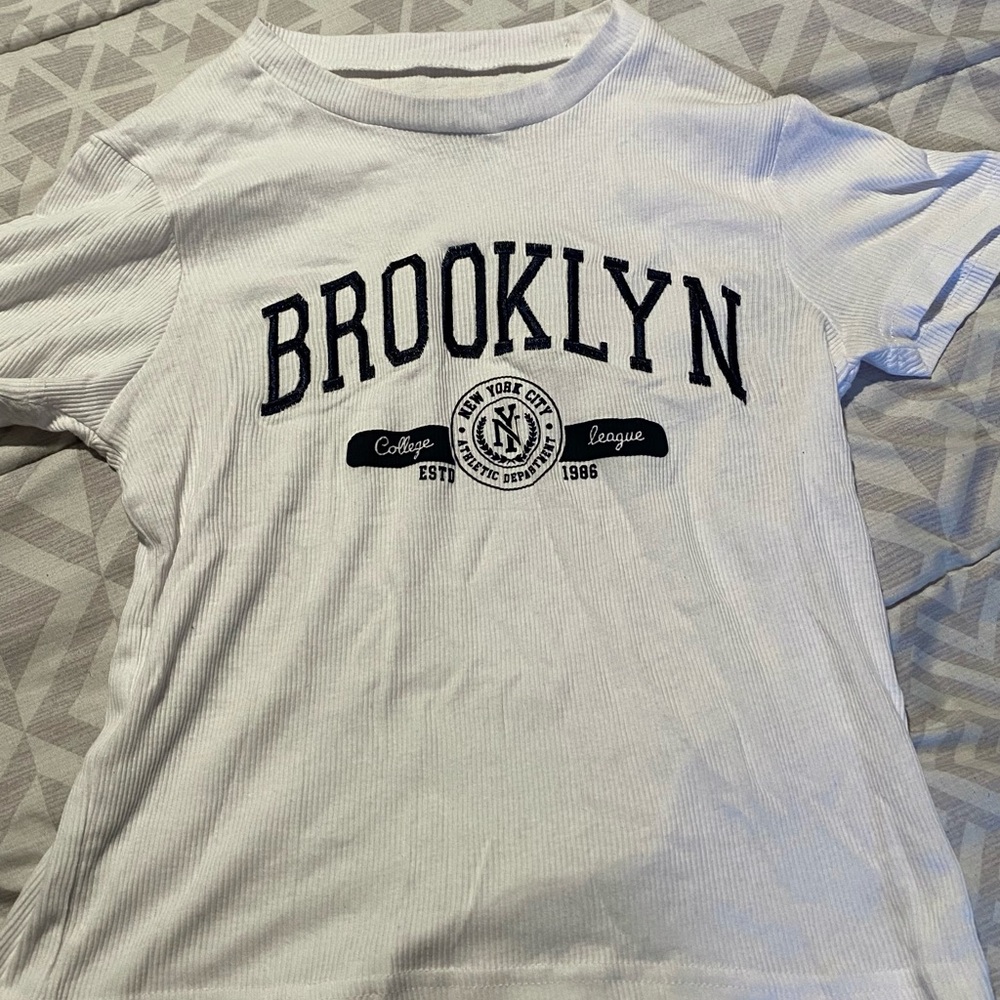 white and black brooklyn coquette baby tee